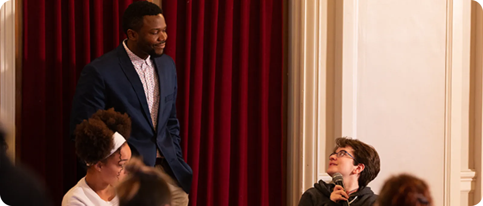 Deo Mwano listening to a student’s question during a college session